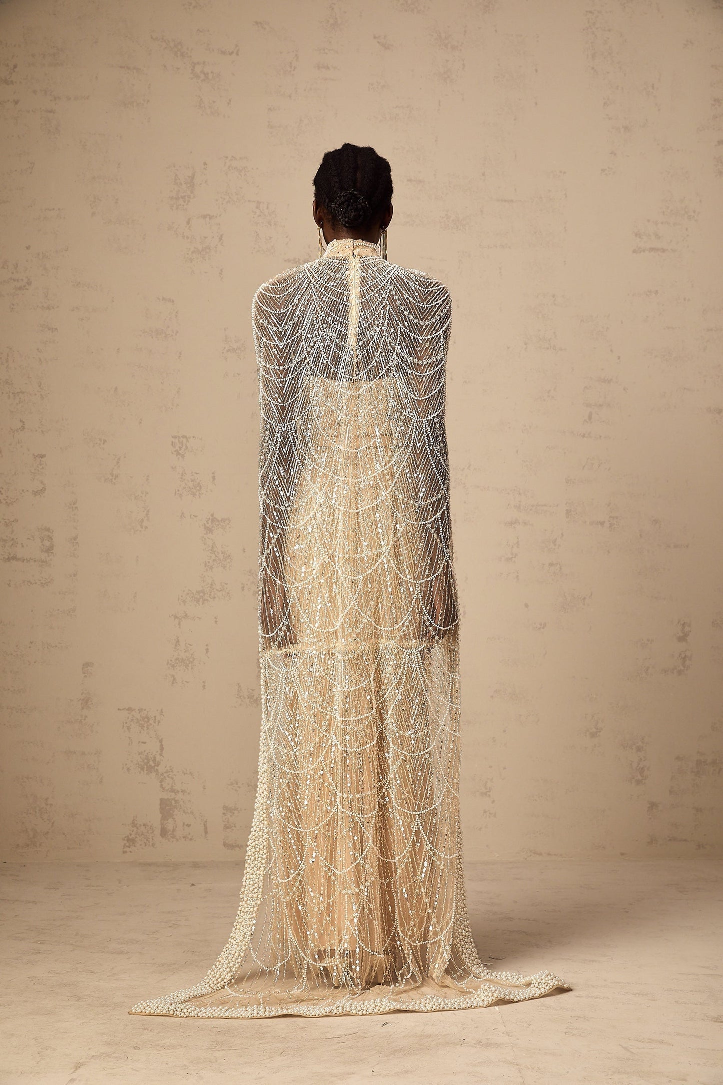 Elegant champagne colored gown with matching beaded cape Frederica set