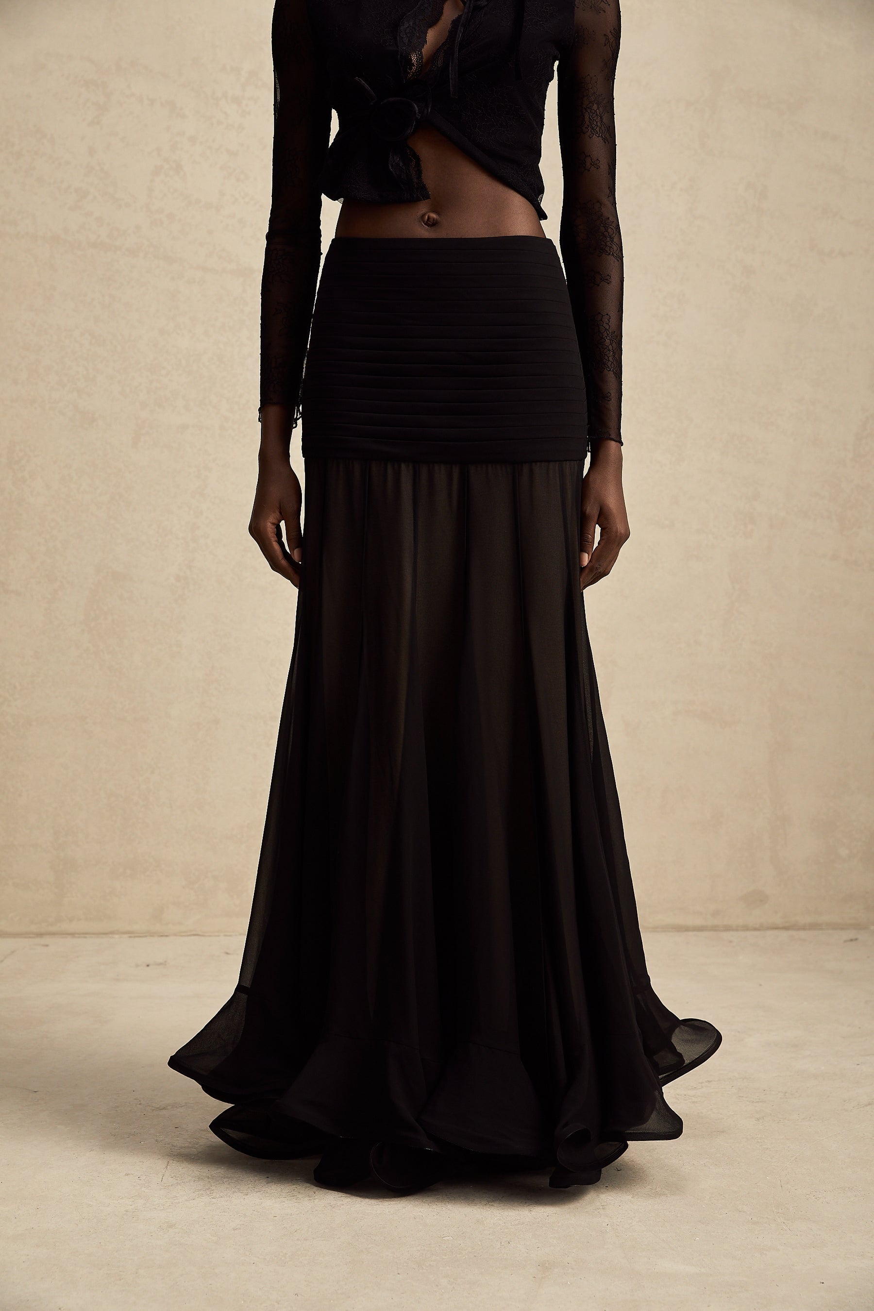 Elegant long maxi skirt with ruffles and pleats made of rayon and tulle fabric in a flowing design