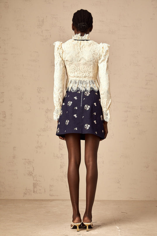 Elegant off white blouse with bowknot detail and floral lace pattern named Anaelle