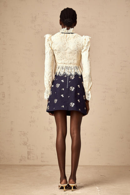 Elegant off white blouse with bowknot detail and floral lace pattern named Anaelle