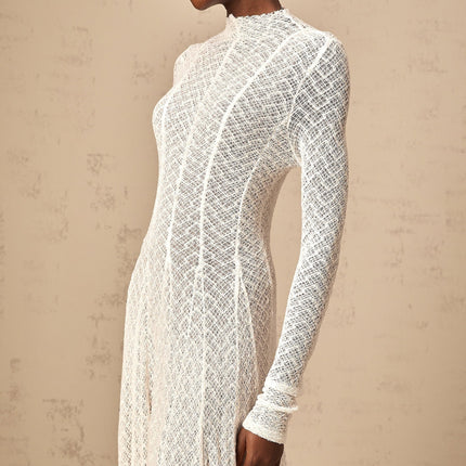 Elegant white maxi dress with allover wavy lace pattern and long sleeves