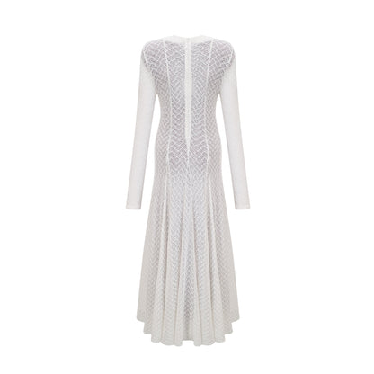 Elegant white maxi dress with intricate wavy lace pattern throughout the bodice and skirt featuring a floor length design and delicate feminine details