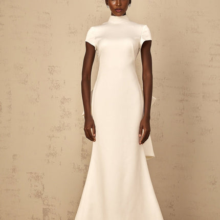 Emanuela White Maxi Dress with Mock Neck Cap Sleeves Open Back Fitted Waistline Boned Bodice Oversize-Bow Mermaid Hem Rear Clasp Zip Fastening 100% Terylene Fiber