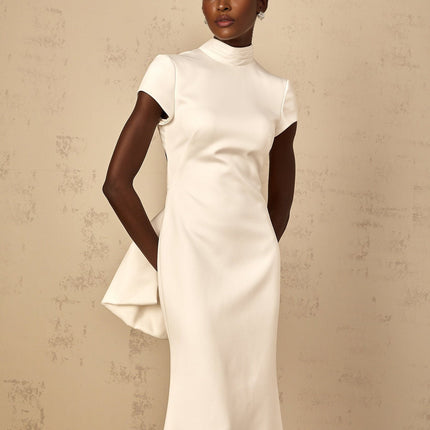 Emanuela White Maxi Dress with Mock Neck Cap Sleeves Open Back Fitted Waistline Boned Bodice Oversize-Bow Mermaid Hem Rear Clasp Zip Fastening 100% Terylene Fiber