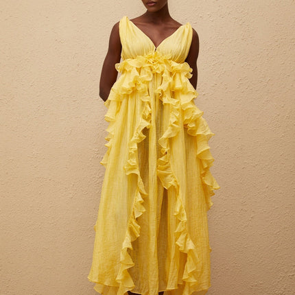 Emilia Yellow Maxi Dress V-neck Sleeveless Open Back Crinkled Ruffled Layered Asymmetrical Hem Fitted Waistline Tassel Detail 100% Terylene Fiber Glamour