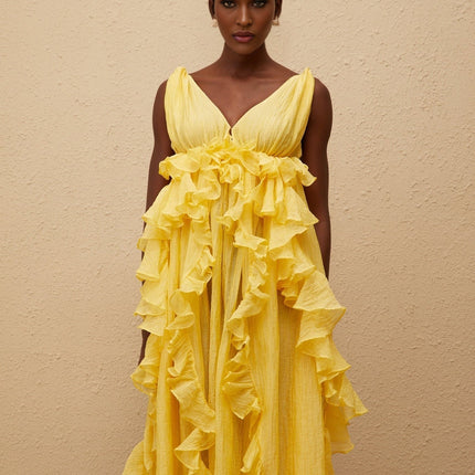 Emilia Yellow Maxi Dress V-neck Sleeveless Open Back Crinkled Ruffled Layered Asymmetrical Hem Fitted Waistline Tassel Detail 100% Terylene Fiber