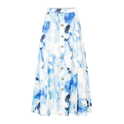 Emily wearing Light Blue Y2K-inspired denim set with printed sleeveless top and matching mid-calf skirt