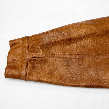 Emily wearing Vintage Brown PU Leather Bomber Jacket