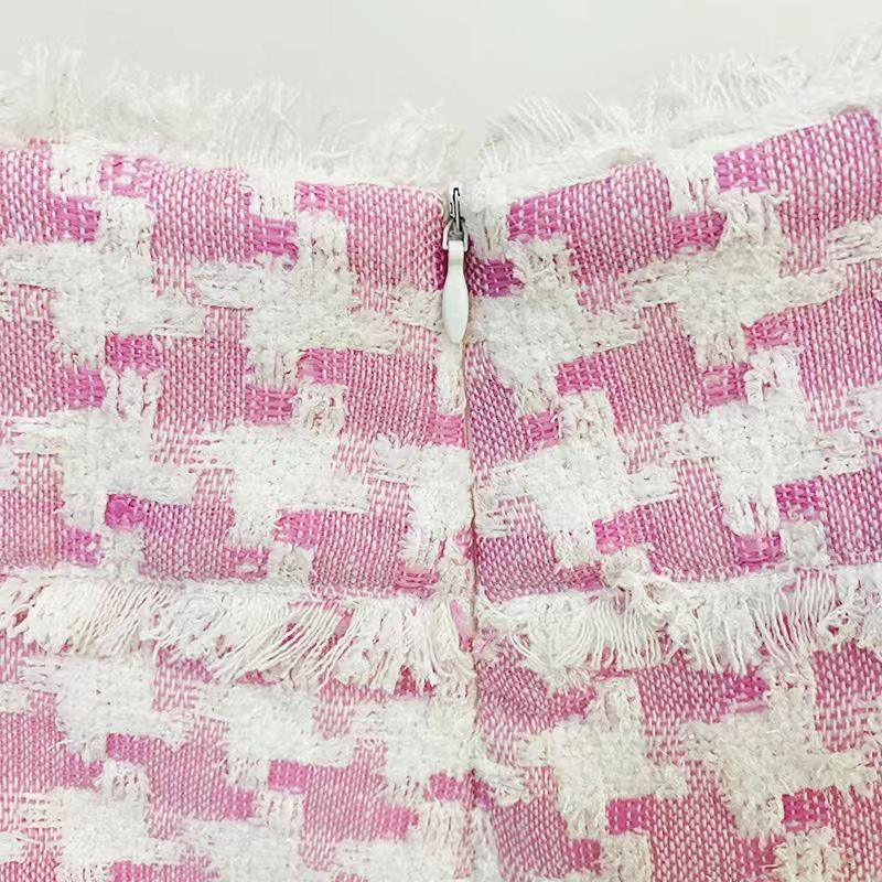Pink houndstooth double-breasted blazer with silver buttons paired with matching high-waisted shorts