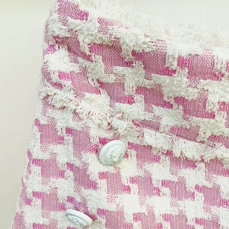 Pink houndstooth double-breasted blazer with silver buttons paired with matching high-waisted shorts