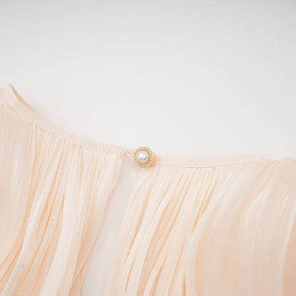 Eugenie fully pleated ruffled mini dress in neutral color short length dress with allover pleats and ruffled details
