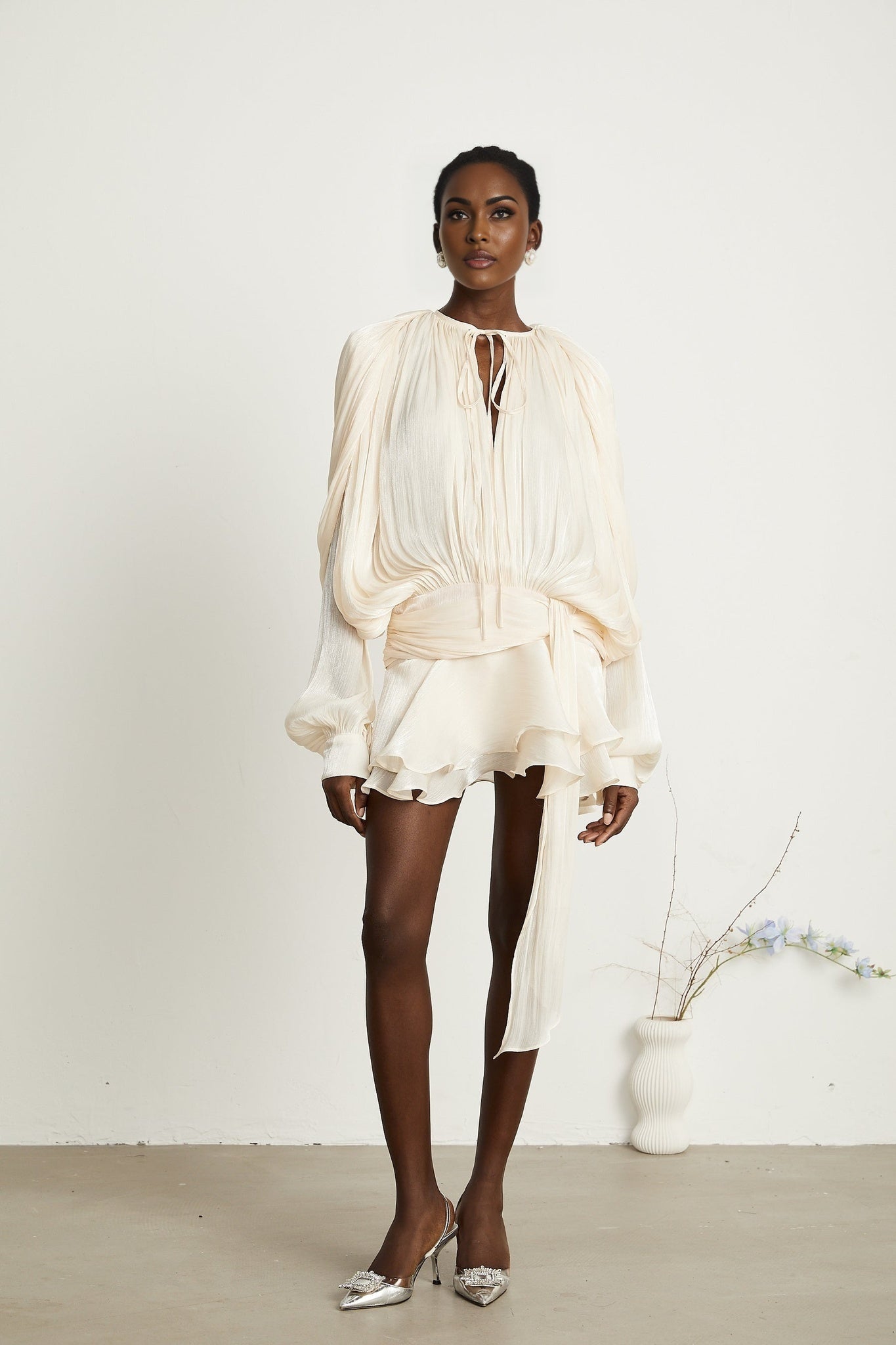 Eugenie neutral colored mini dress with full pleats and ruffles