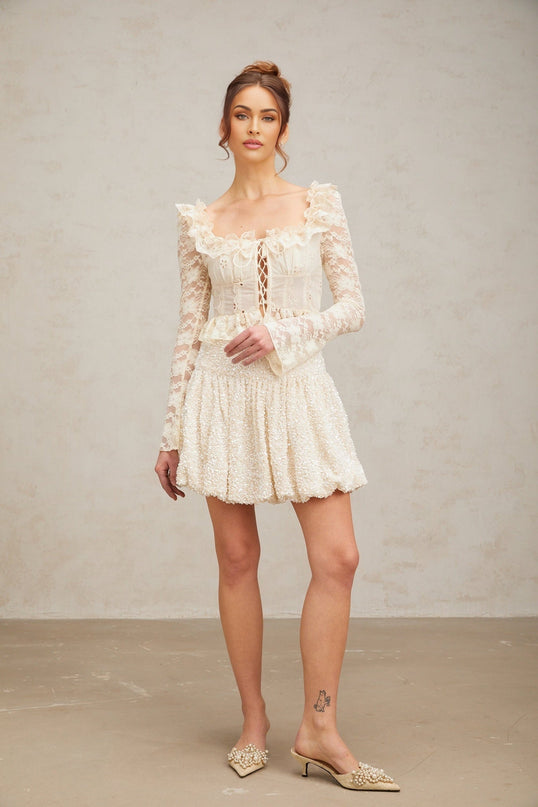 Eugenie off white blouse with floral lace pattern and ruffled details