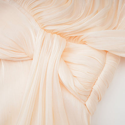 Eugenie pleated ruffled mini dress in neutral color with full skirt and delicate feminine details
