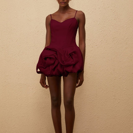 Eulalia Mini Dress in Red with V-neck, spaghetti straps, boned bodice, cinched waist, 3D-petal detailing, bubble skirt, and smocked panel