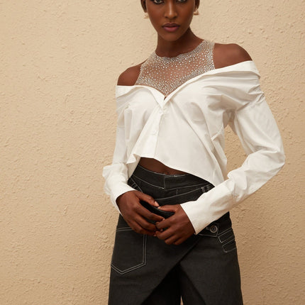 Fiona Shirt in White 100 Percent Cotton Cold Shoulder Mesh Panelling Rhinestone Embellishment Asymmetrical Hem Front Button Fastening Long Sleeves Cropped Silhouette