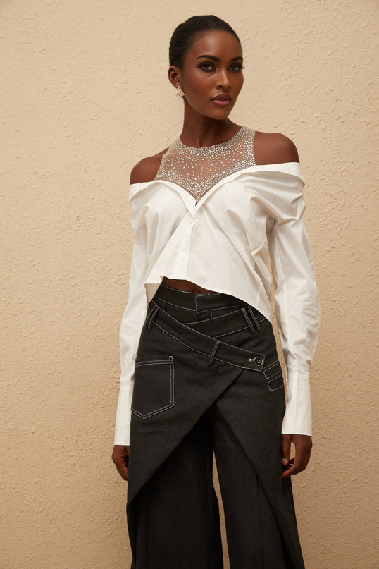 Fiona Shirt in White 100% Cotton Cold Shoulder Mesh Panelling Rhinestone Embellishment Asymmetrical Hem Front Button Fastening Long Sleeves Cropped Silhouette