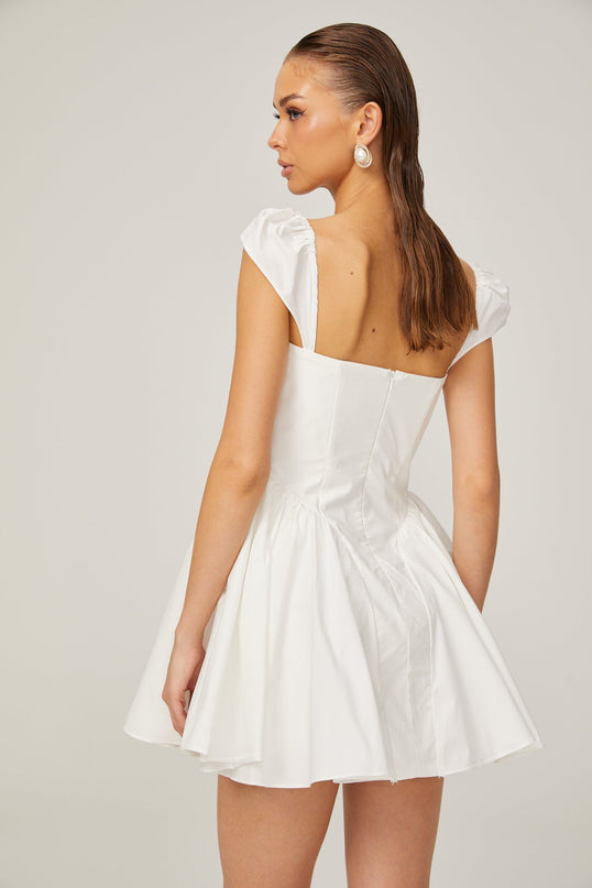 Fiorella White Mini Dress Sleeveless Boned Bodice Pleat Detailing Flared Skirt Decorative Buttons Rear Zip Fastening