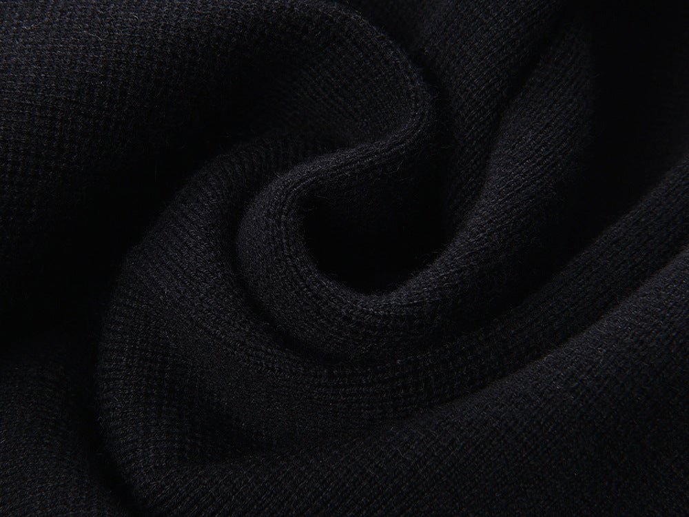 Flared pleated black skirt with gold decorative buttons