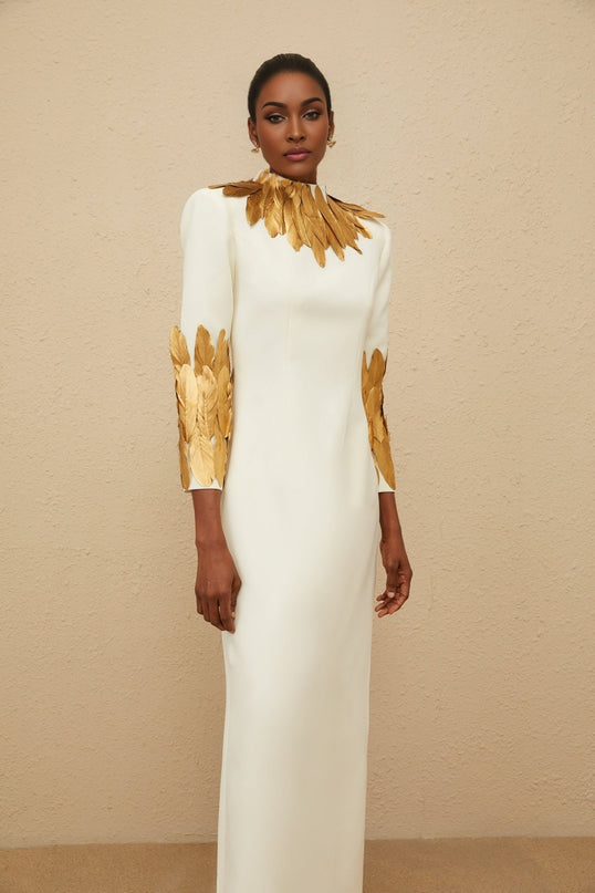 Flora White Maxi Dress with Turtleneck, Long Sleeves, Feather Trim, Fitted Waistline, Rear Slit, and Straight Hem