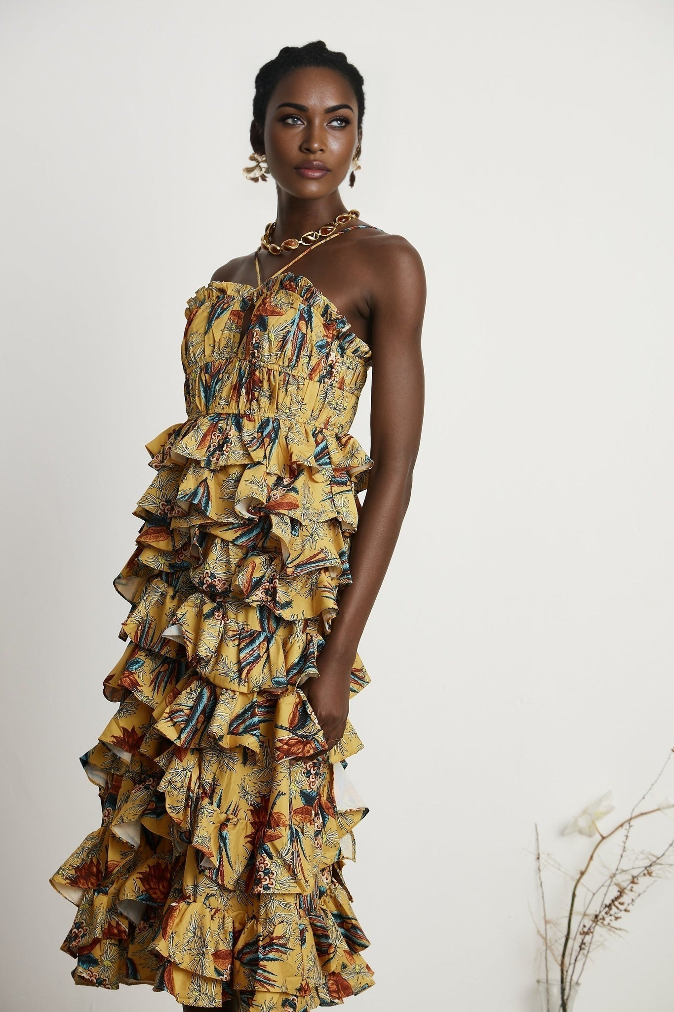 Floral print midi dress with tiered ruffles named Apolline featuring a layered skirt design and allover flower pattern