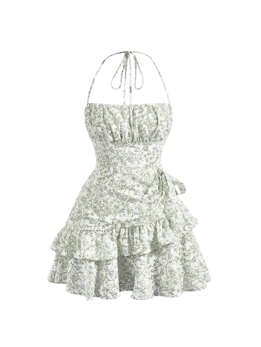 Green floral halter mini dress with ruched bust, layered ruffled hem, and adjustable tie waist, designed for a romantic and feminine look
