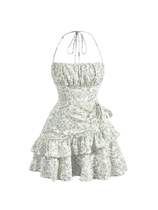 Green floral halter mini dress with ruched bust, layered ruffled hem, and adjustable tie waist, designed for a romantic and feminine look