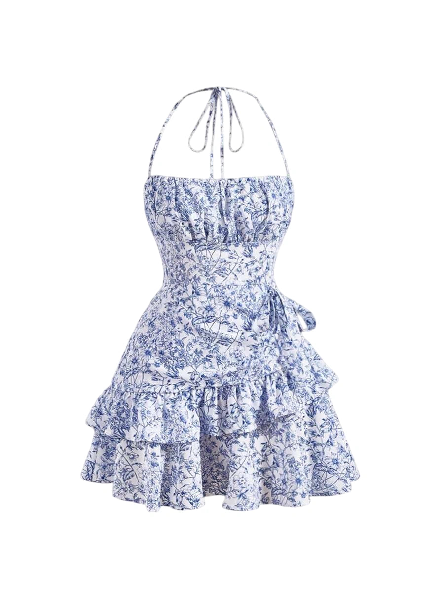 Floral print halter dress with ruffled skirt, perfect for a sunny day or casual outing. Ideal for a fresh and feminine look
