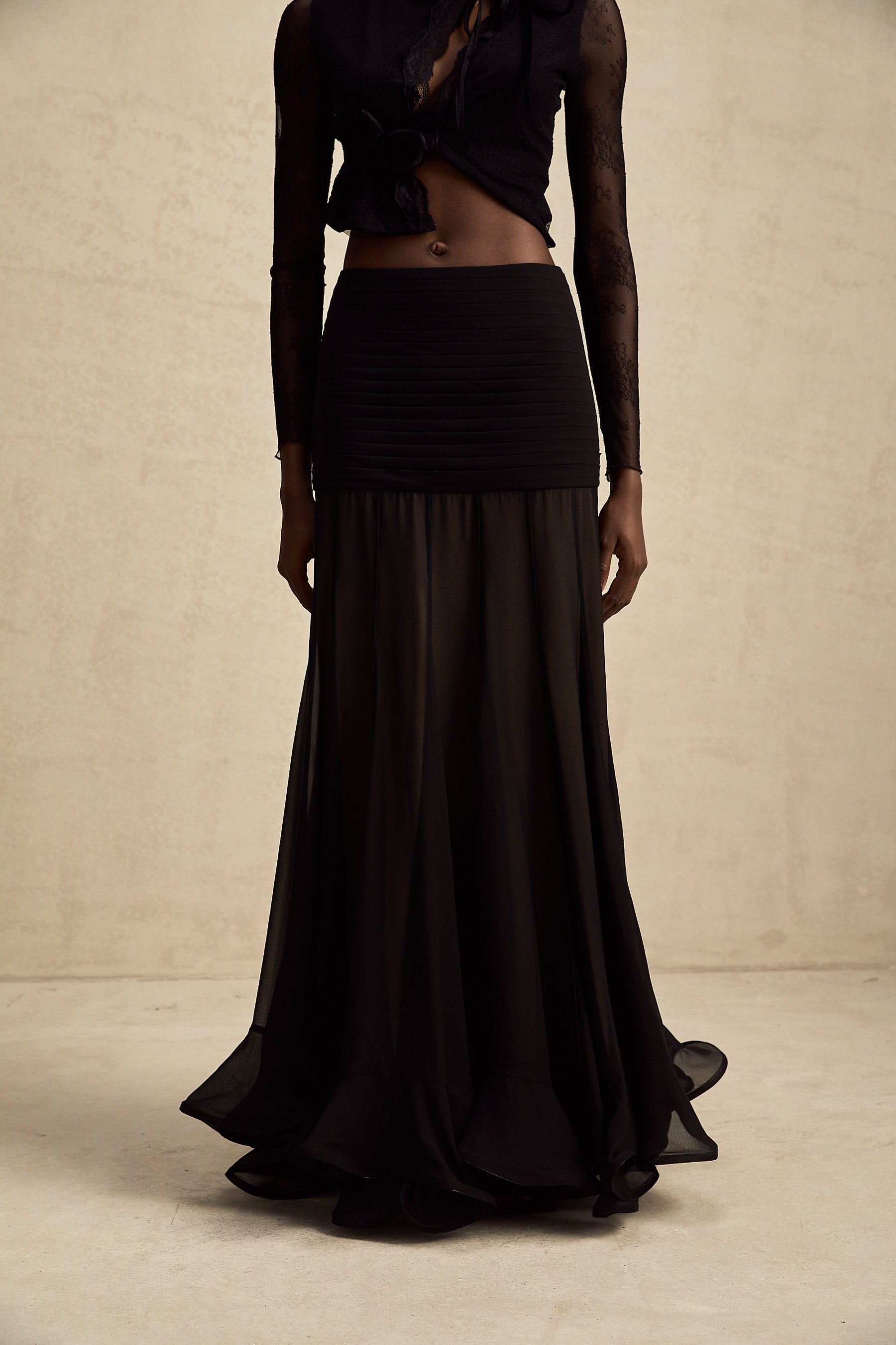 Flowy maxi skirt with ruffles and pleats made from rayon and tulle fabric in a light color