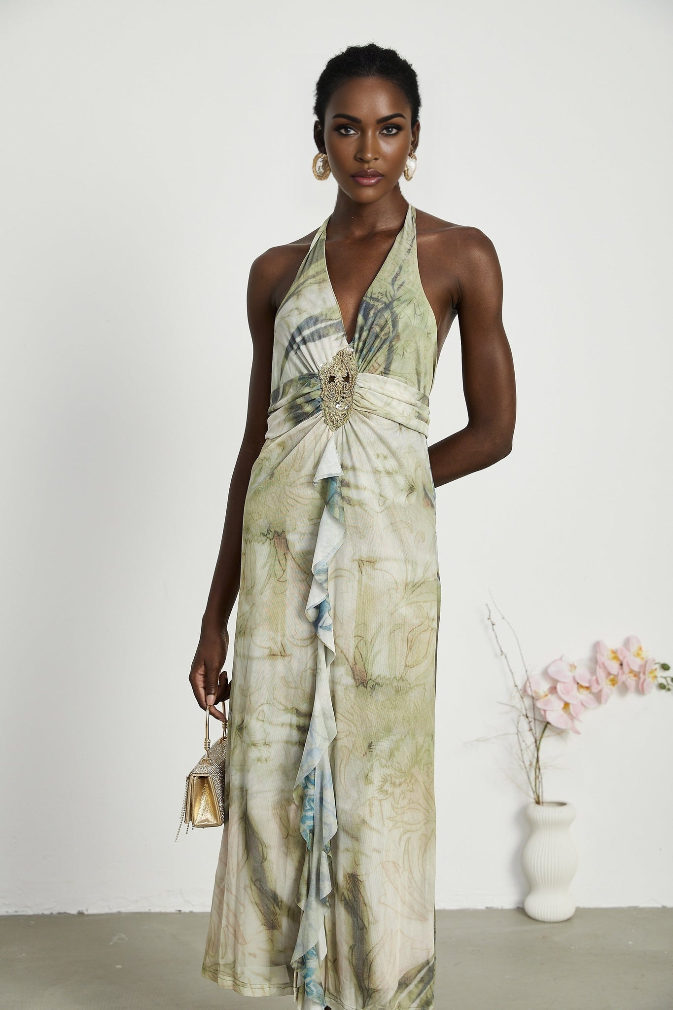 Flowy midlength dress with neckholder style and ombre print pattern fading from dark to light colors