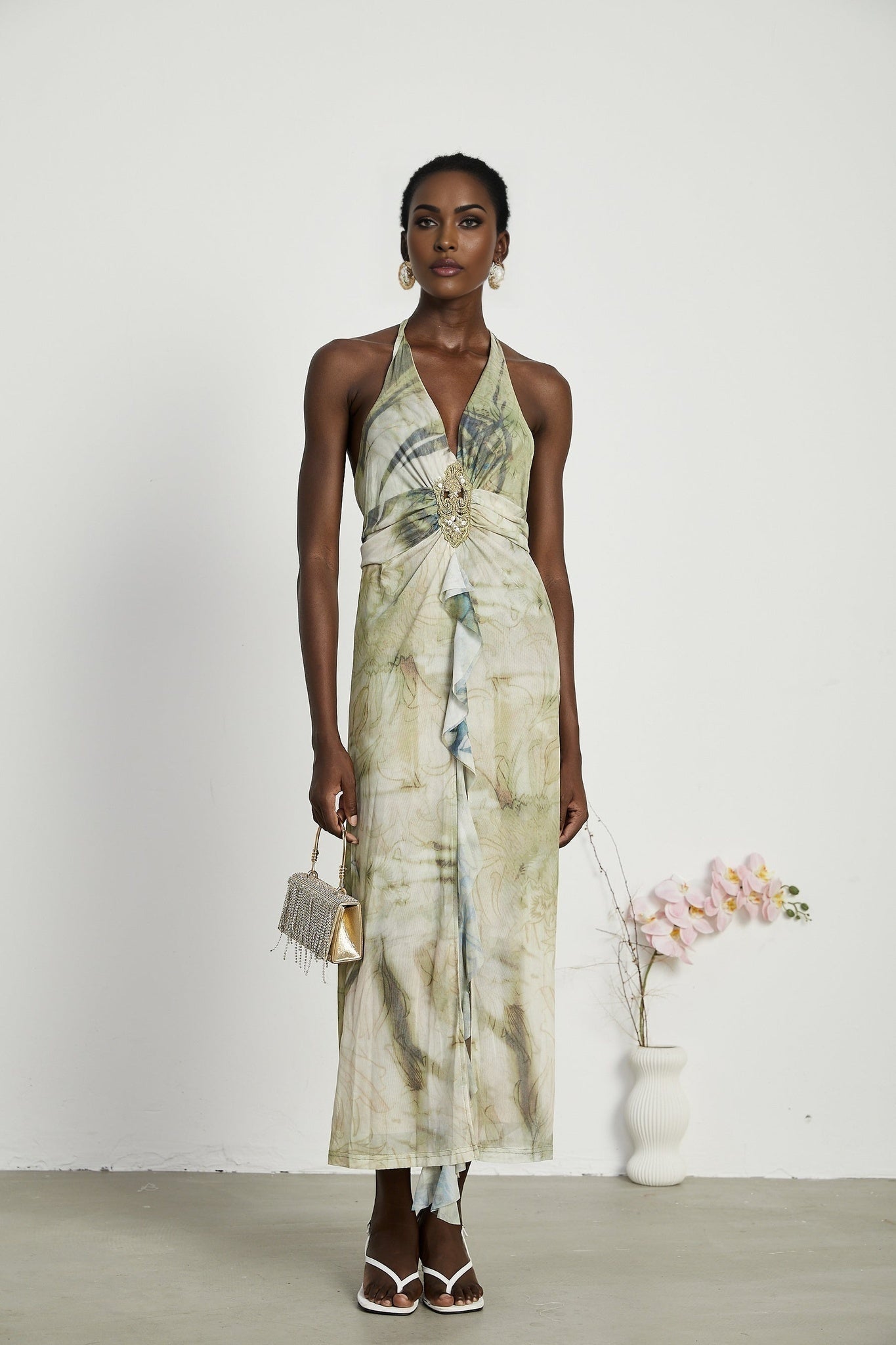 Flowy midlength dress with neckholder style and ombre print pattern fading from dark to light