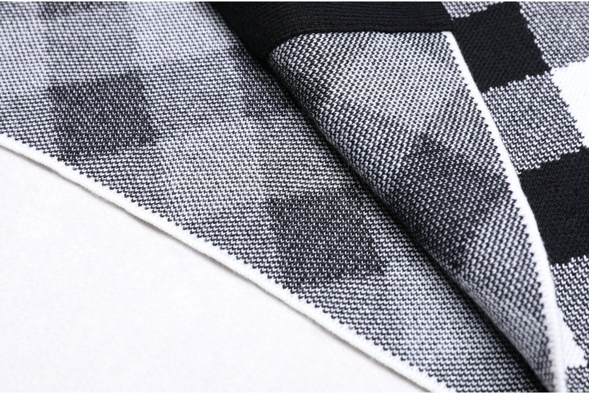 Form-fitting black and white plaid halter top with gold buttons