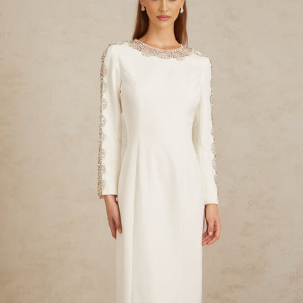 Freja White Crystal Embellished Maxi Gown in pristine white with crystal embellishments and tulle panelling, long sleeves, and rear slit