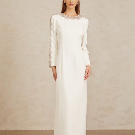 Freja White Crystal Embellished Maxi Gown in pristine white with crystal embellishments and tulle panelling, long sleeves, and rear slit