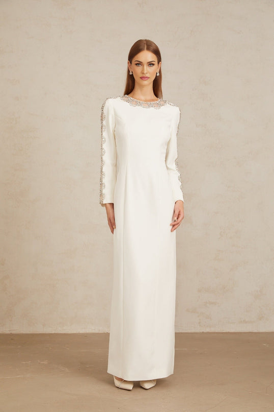 Freja White Crystal Embellished Maxi Gown in pristine white with crystal embellishments and tulle panelling, long sleeves, and rear slit