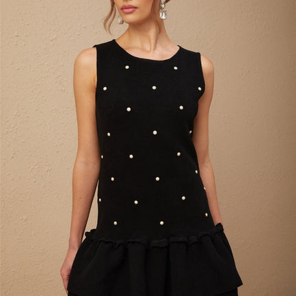 Freya Black Mini Dress with Peplum Hem and Bead Embellishments