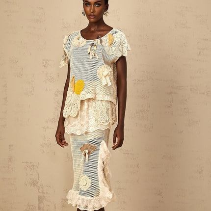 Gelsomina Lace Crochet Skirt in Neutrals high-rise midi skirt with cut-out design and bow detailing