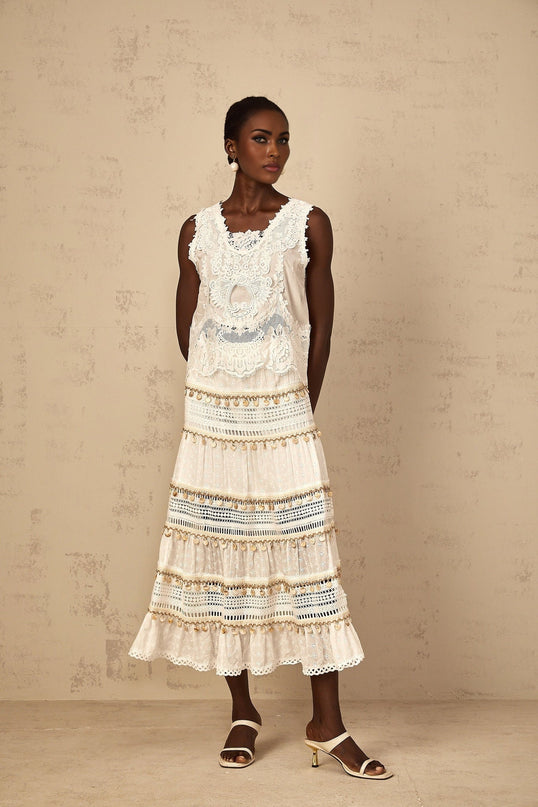 Gemmina White Cropped Top Floral Embroidered Frayed Edge 100 Percent Cotton Sleeveless Cut Out Detailing Chic Silhouette Contemporary Allure Day Evening Wear Versatile On Trend Sophisticated Charm High Waisted Trousers Flowing Skirt Modern Twist Stand Out Style