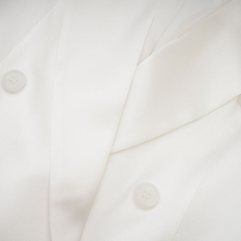 Genesis White Silk Double-Breasted Blazer Notch Lapels Shoulder Pads Buttoned Cuffs Long Sleeves Front Flap Pockets Front Button Closure