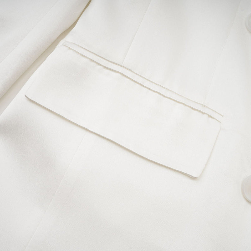 Genesis White Silk Double-Breasted Blazer Notch Lapels Shoulder Pads Buttoned Cuffs Long Sleeves Front Flap Pockets Front Button Closure