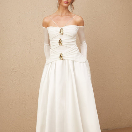 Giannina White Maxi Dress Off-Shoulder Gold Hardware Flared Skirt Pleated Detailing Ankle-Length Long Sleeves Spaghetti Straps Gathered Effect Polyester Cotton Elegant Glamorous Luxurious Sophisticated Fashionista Statement Event
