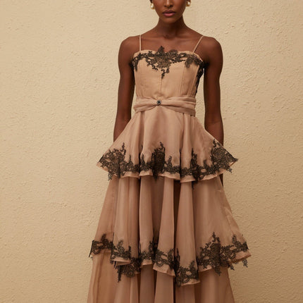 Ginevra Maxi Dress in Brown Black hue with tiered tulle and floral lace trim, square neck, spaghetti straps, fitted waistline, and rear zip fastening