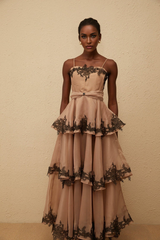 Ginevra Maxi Dress in Brown Black hue with tiered tulle and floral lace trim, square neck, spaghetti straps, fitted waistline, and rear zip fastening