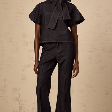 Giuditta Denim Blouse and Jeans Set in Indigo Blue with Ribbon tie-neck detailing, Short puff sleeves, Flared hem, and Contrast stitching