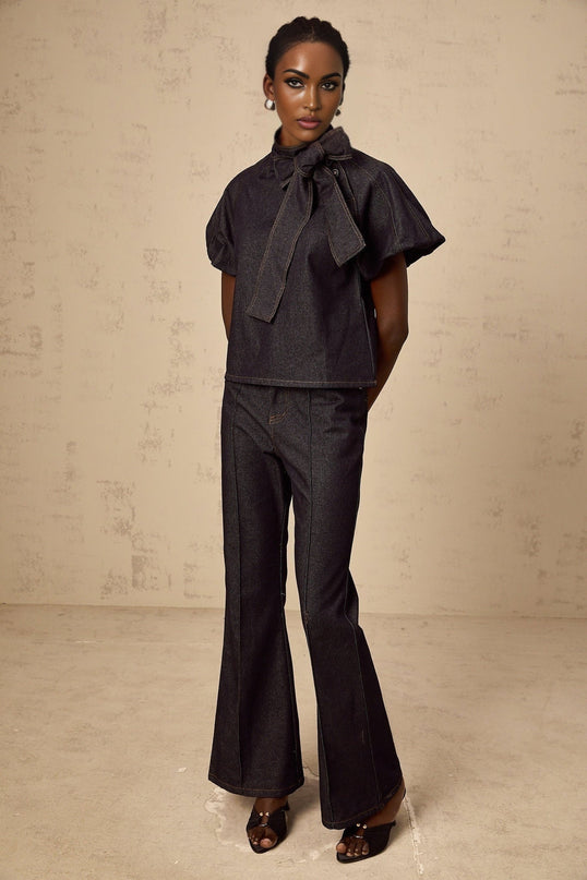 Giuditta Denim Blouse and Jeans Set in Indigo Blue with Ribbon tie-neck detailing, Short puff sleeves, Flared hem, Classic five pockets, Contrast stitching, and 100% Cotton fabric