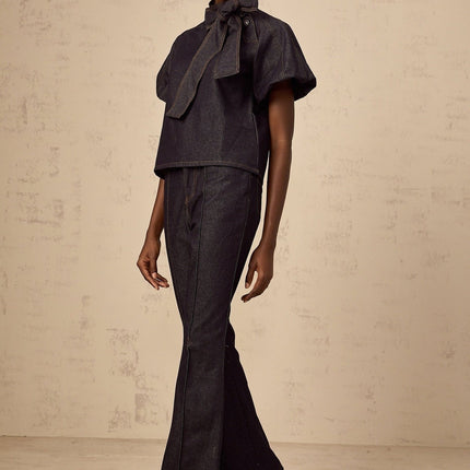 Giuditta Denim Blouse & Jeans Set in Indigo Blue with Ribbon tie-neck detailing, Short puff sleeves, Flared hem, Classic five pockets, and Contrast stitching