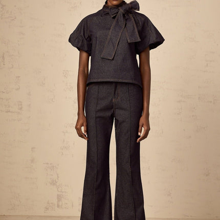 Giuditta Denim Blouse and Jeans Set in Indigo Blue with Ribbon tie-neck detailing, Short puff sleeves, Flared hem, Classic five pockets, and Contrast stitching