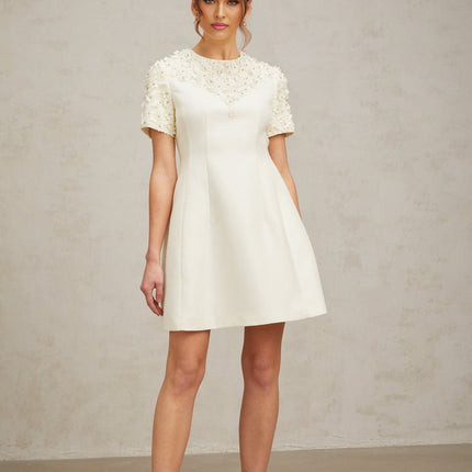Giulia Mini Dress Neutrals Floral Appliqués Crystal Embellishments A-line Silhouette Short Sleeves Round Neck Waist Cinched Rear Zip Fastening Thigh Length 100% Terylene Luxury Style