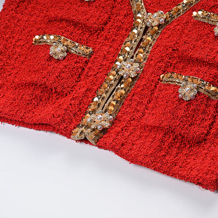 Elegant red tweed jacket with gold embellishments paired with a matching midi skirt, ideal for formal occasions