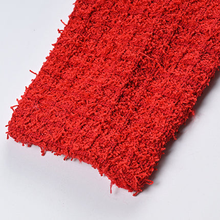 Elegant red tweed jacket with gold embellishments paired with a matching midi skirt, ideal for formal occasions